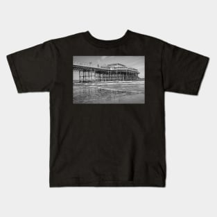 Side on view of the Victorian Cromer pier on the Norfolk coast Kids T-Shirt